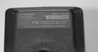 The serial number is on a gray metallic plate on the bottom of the unit