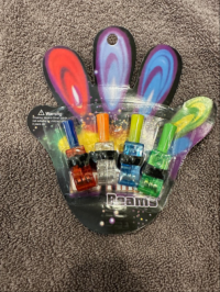 Picture of ZMC Group Recalls LED Finger Beam Lights Due to Risk of Serious Injury or Death from Battery Ingestion; Violates Mandatory Standard for Toys