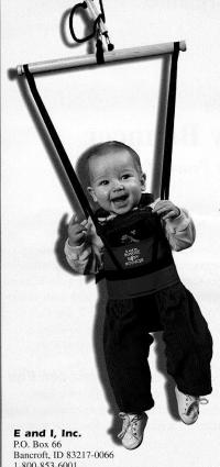 Picture of a baby in a Bungee Baby Bouncer smiling
